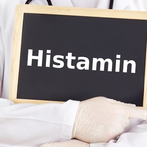 Doctor shows information on blackboard: histamine